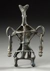A WESTERN ASIATIC AMLASH OPENWORK BRONZE IDOL, CIRCA 1ST MILLENIUM B.C.