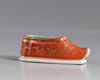 A  gilt Chinese porcelain shoe