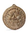 A SELJUK FIGURAL TERRACOTTA TILE ANTEFIX, 12TH CENTURY