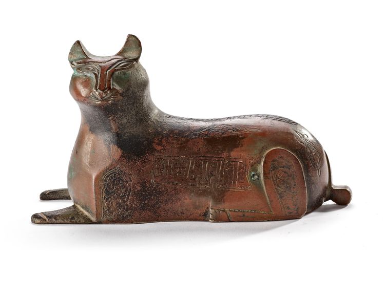 A KHORASAN BRONZE WEIGHT FIGURINE IN THE FORM OF A LION, PERSIA, 12TH CENTURY