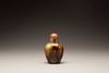 A celadon and russet jade snuff bottle