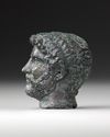 A MINIATURE BRONZE HEAD OF THE EMPEROR HADRIAN, 117-138 AD 2ND CENTURY AD