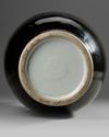 A RARE FAMILLE ROSE-DECORATED MIRROR-BLACK-GLAZED DOUBLE-GOURD VASE, CHINA, 18TH CENTURY