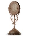A GILT DECORATED METAL MIRROR HOLDER