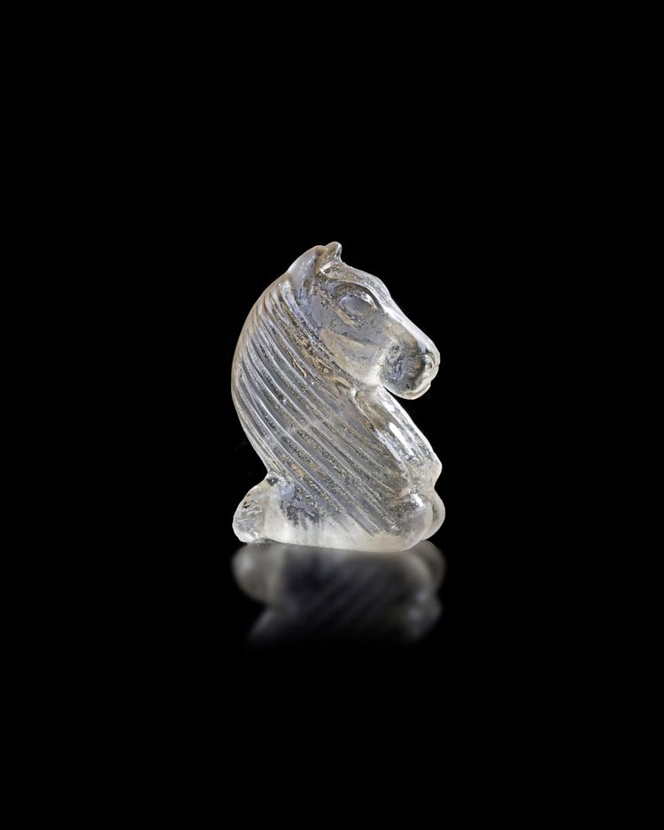 AN ISLAMIC CARVED ROCK CRYSTAL CHESS PIECE, 18TH/19TH CENTURY