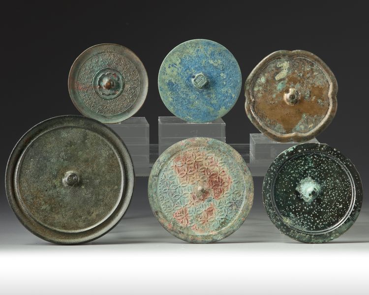 A group of six Chinese bronze mirrors