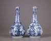 A pair of Chinese moulded blue and white 'Kraak' garlic neck vases