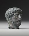 A MINIATURE BRONZE HEAD OF THE EMPEROR HADRIAN, 117-138 AD 2ND CENTURY AD
