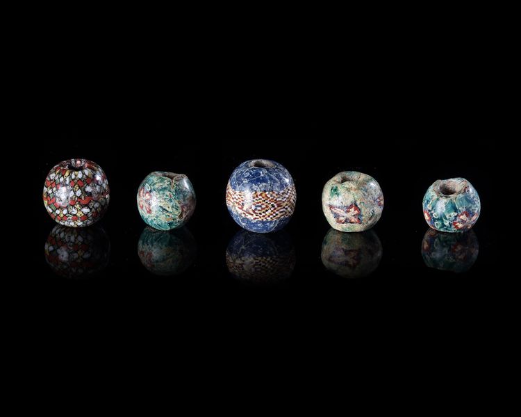 FIVE ROMAN GLASS MOSAIC OR MILLEFIORI BEADS, 1ST CENTURY AD