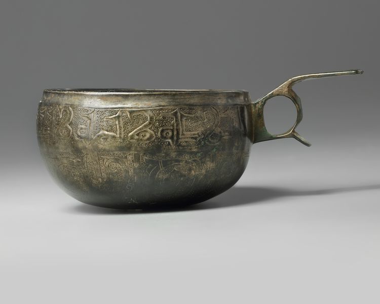 A bronze Seljuq cup with handle