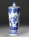 A CHINESE BLUE AND WHITE BELL-SHAPED COVERED VASE, QING DYNASTY (1644-1911)