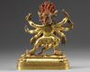 A Tibetan gilt bronze six-armed Mahakala