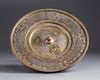An Islamic silver inlaid brass hand wash bowl