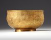 A PERSIAN GILT COPPER BOWL
