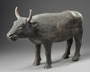 A RARE CHINESE PAINTED POTTERY FIGURE OF AN OX, HAN DYNASTY (206 BC-220 AD)