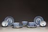 Five blue and white porcelain cups and saucers