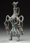 A WESTERN ASIATIC AMLASH OPENWORK BRONZE IDOL, CIRCA 1ST MILLENIUM B.C.