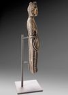 A FINELY CARVED STONE FIGURE OF A STANDING BUDDHIST DEITY