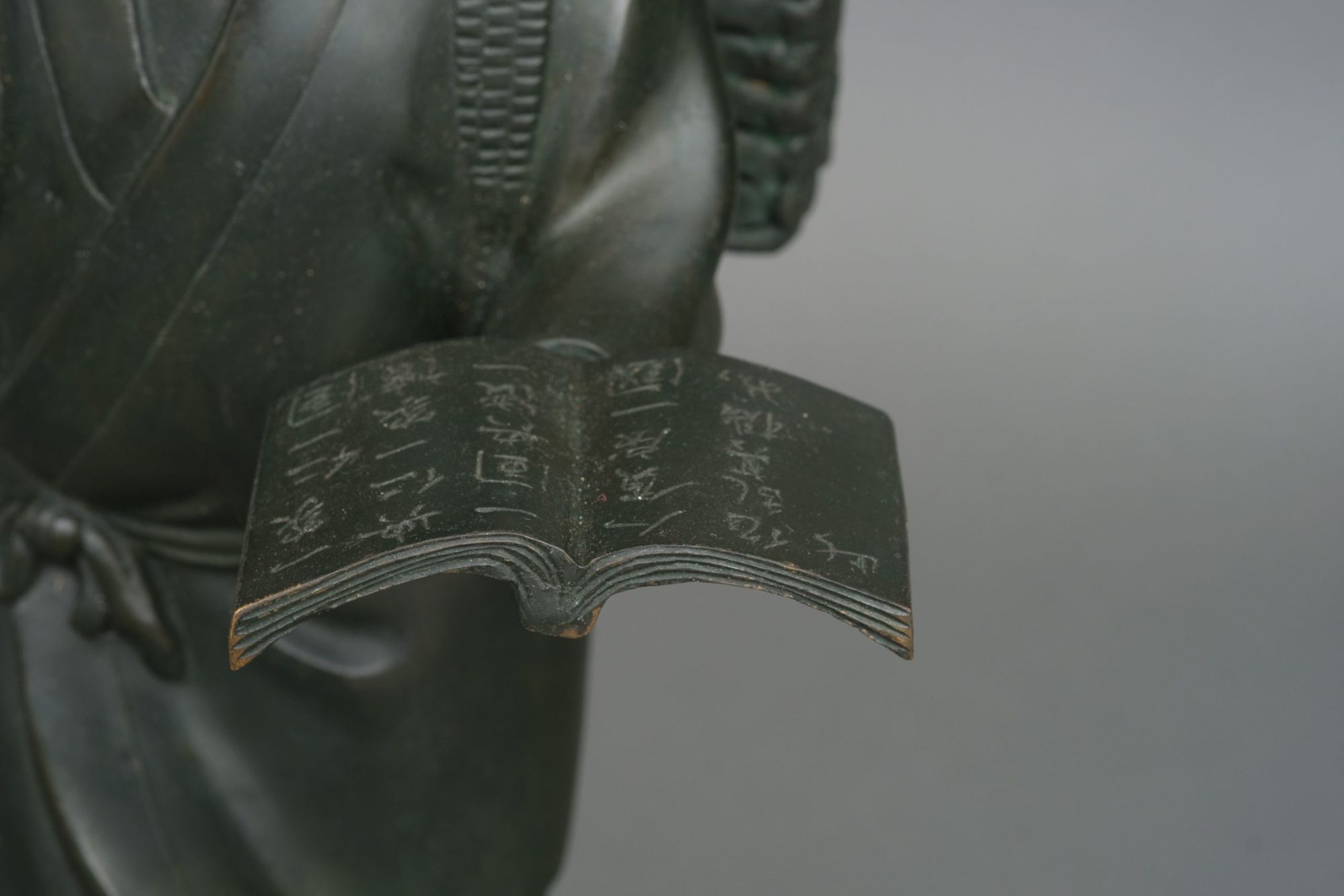 A BRONZE OKIMONO 置物 OF NINOMIYA SONTOKU 二宮 尊徳