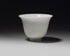 A Chinese white-glazed 'phoenix' cup