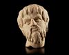 A POTTERY HEAD OF A BEARDED MAN, POSSIBLY BYZANTINE PERIOD