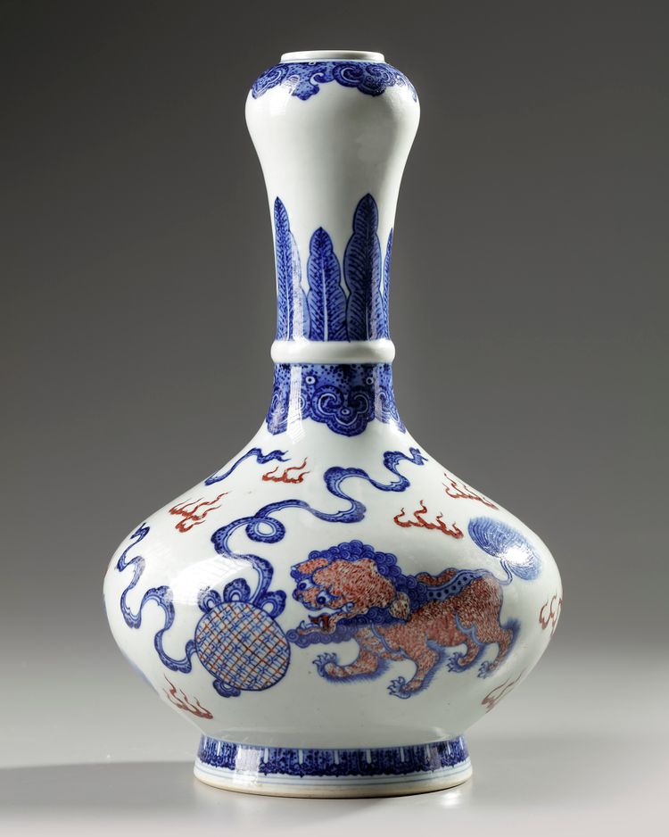 A Chinese copper-red-decorated blue and white garlic-head vase