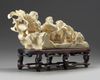A Chinese carved ivory 'children and vegetable' carving
