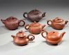 A group of six Chinese medium-sized yixing teapots
