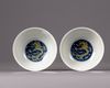 A pair of Chinese yellow-enamelled blue and white 'dragon' bowls