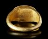 A ROMAN GOLD RING WITH A CARNELIAN INTAGLIO OF NEPTUNE IN A BIGA OF HIPPOCAMPS, 1ST CENTURY AD