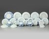A group of Chinese blue and white 'figural' cups and saucers