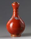 A Chinese coral-ground famille rose 'bird and flowers' garlic-head vase