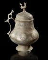 A KHORASSAN SILVER INLAID COVERED JUG NORTH EAST PERSIA, 12TH CENTURY