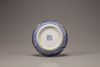 An aubergine-ground blue and white 'dragon' circular box and cover