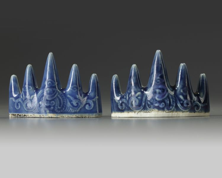 A pair of Chinese blue glazed 'mountain' brush rests
