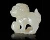 A CHINESE JADE CARVED BUDDHIST LION, 20TH CENTURY