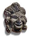 A SCULPTED CARVED LIMESTONE BACCHUS WALL FOUNTAIN MASK, 20TH CENTURY