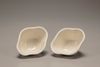 A pair of white-glazed lobed cups