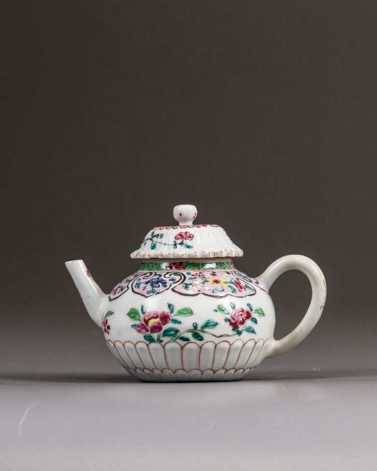 A small Chinese famille rose moulded teapot and cover