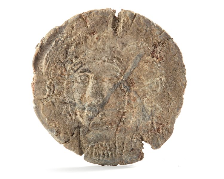 A CIRCULAR LEAD PLAQUE SHOWING ATHENA, GREEK, 4TH-3RD CENTURY BC