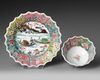 a CHINESE FAMILLE ROSE CHRYSANTHEMUM-FORM CUP AND SAUCER, EARLY QIANLONG PERIOD (1735-1795)