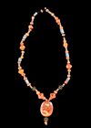 A CARNELIAN CAMEO NECKLACE WITH LAPIS ACCENTS