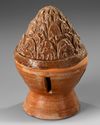 A CHINESE BROWN GLAZED BURNER, EASTERN HAN DYNASTY (25-220 AD)