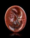 A ROMAN RED JASPER INTAGLIO WITH A BUST OF MEN, 1ST-2ND CENTURY AD