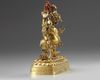 A Tibetan gilt bronze six-armed Mahakala