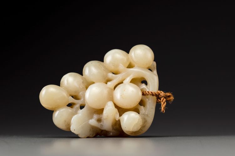 A creamy jade 'squirrel and grapes' group