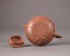 A Chinese yixing 'lotus-leaf' teapot and cover