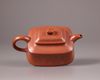 A Chinese yixing slip-decorated teapot and cover