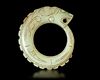 A LIGHT GREEN JADE OUROBOROS DRAGON PENDANT, CHINA, WESTERN ZHOU DYNASTY