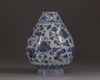 A small blue and white vase